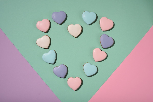 Heart-Shaped Cookies Lie in Shape of Heart on Multicolored Background